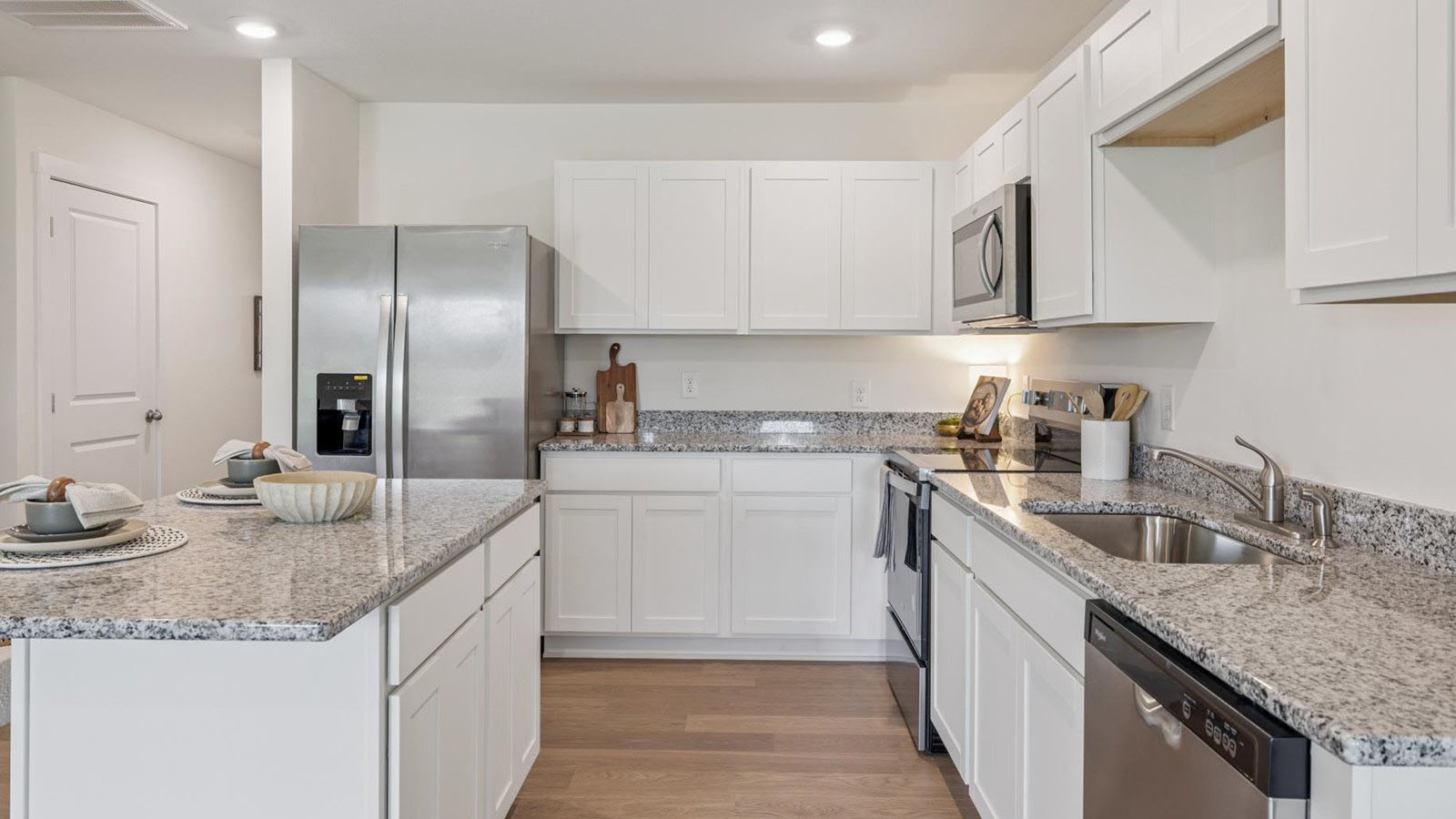 Open concept living, dining, and kitchen space