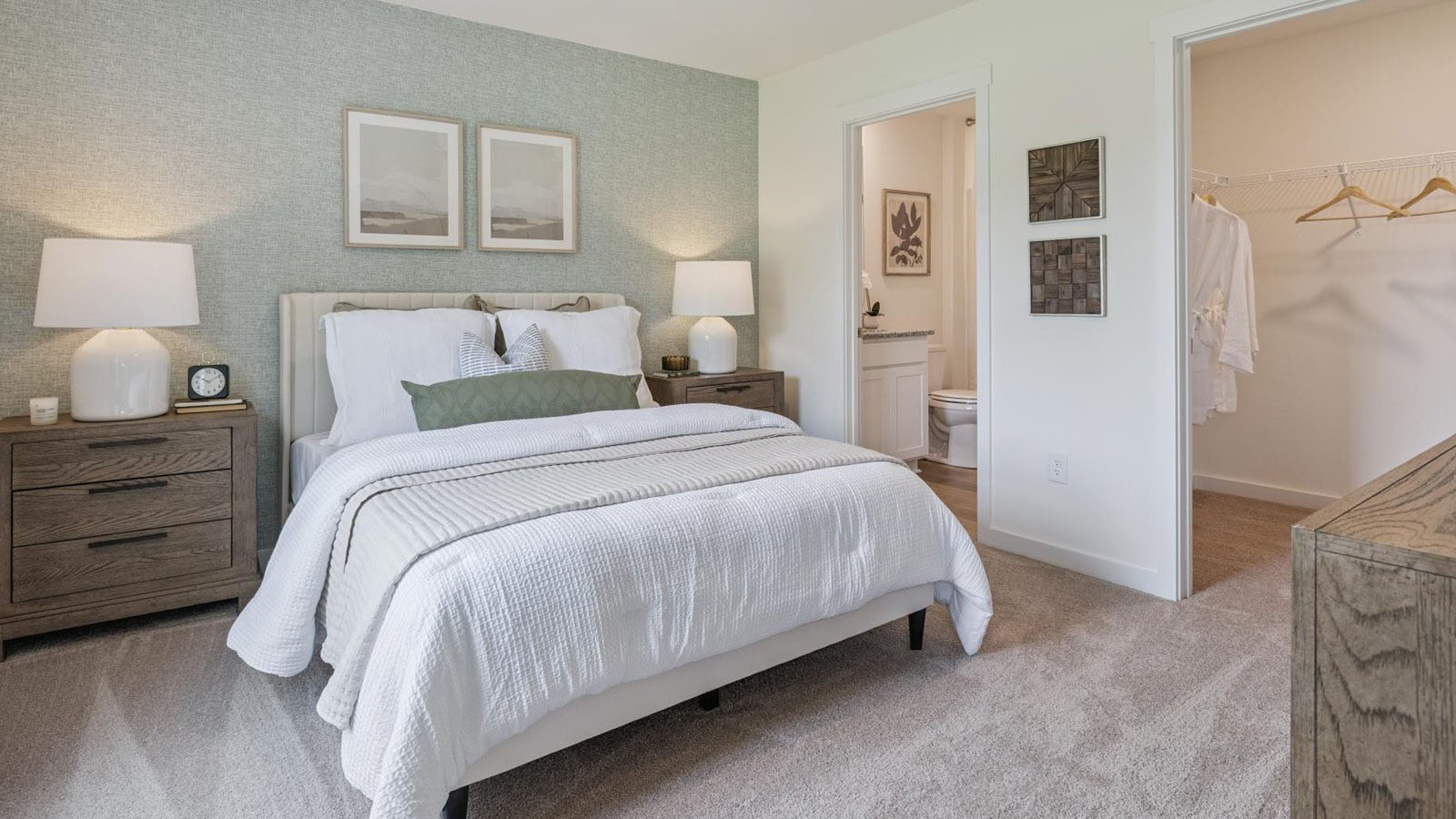 Primary bedroom with private attached bathroom and walk-in closet