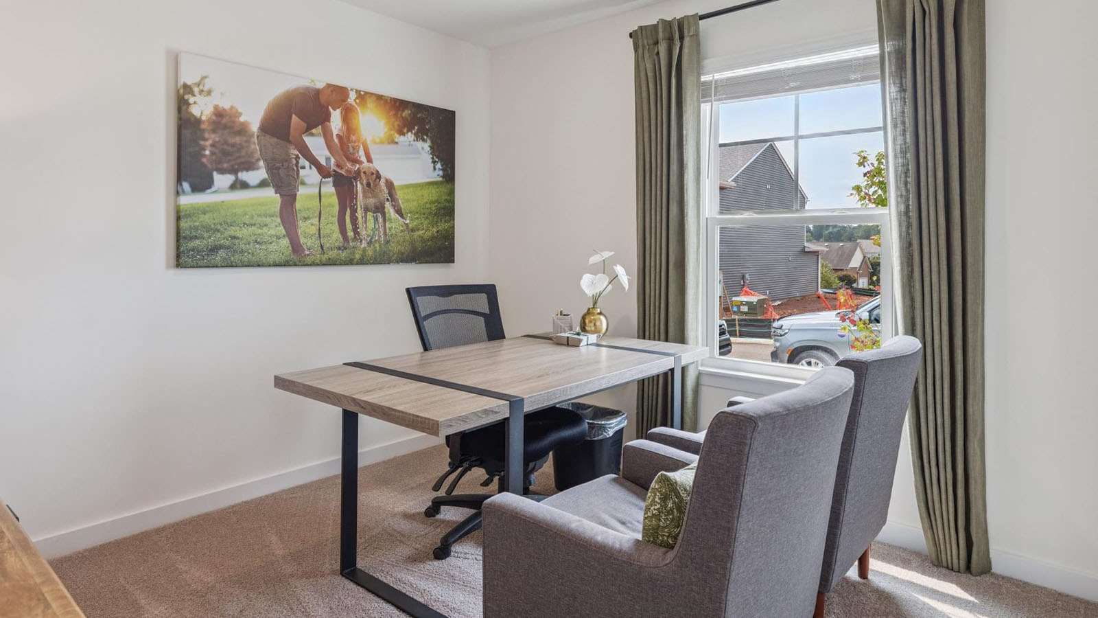 Bedroom with ample natural light and carpet floors