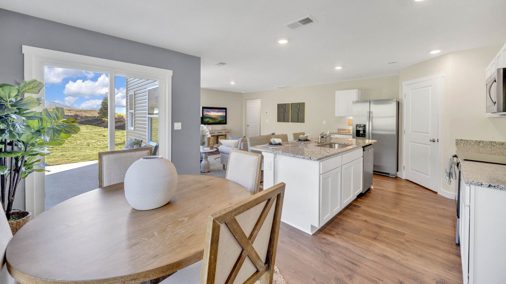 Open concept kitchen, living, and dining room space