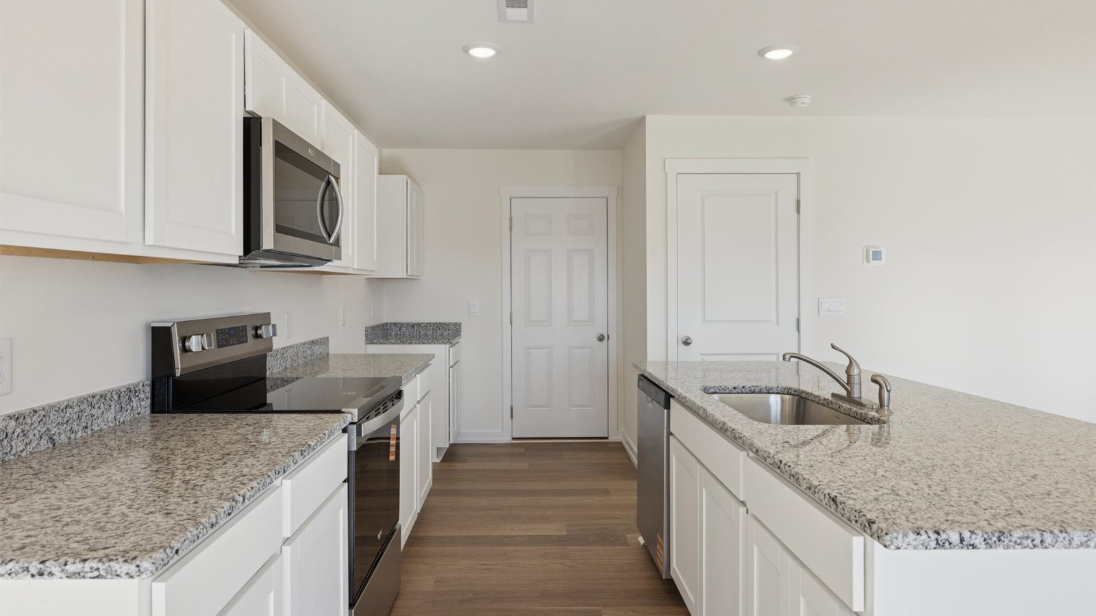 Open concept living, dining, and kitchen space