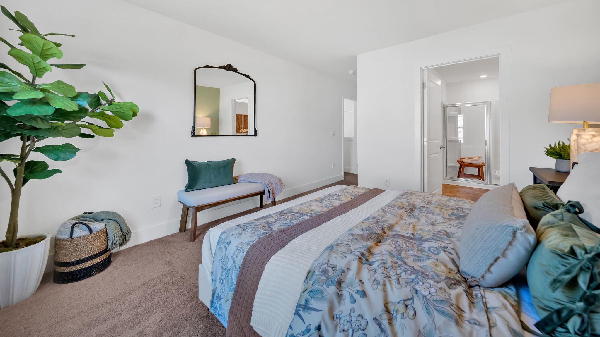 Primary bedroom with plush carpet floors and double light allowing windows