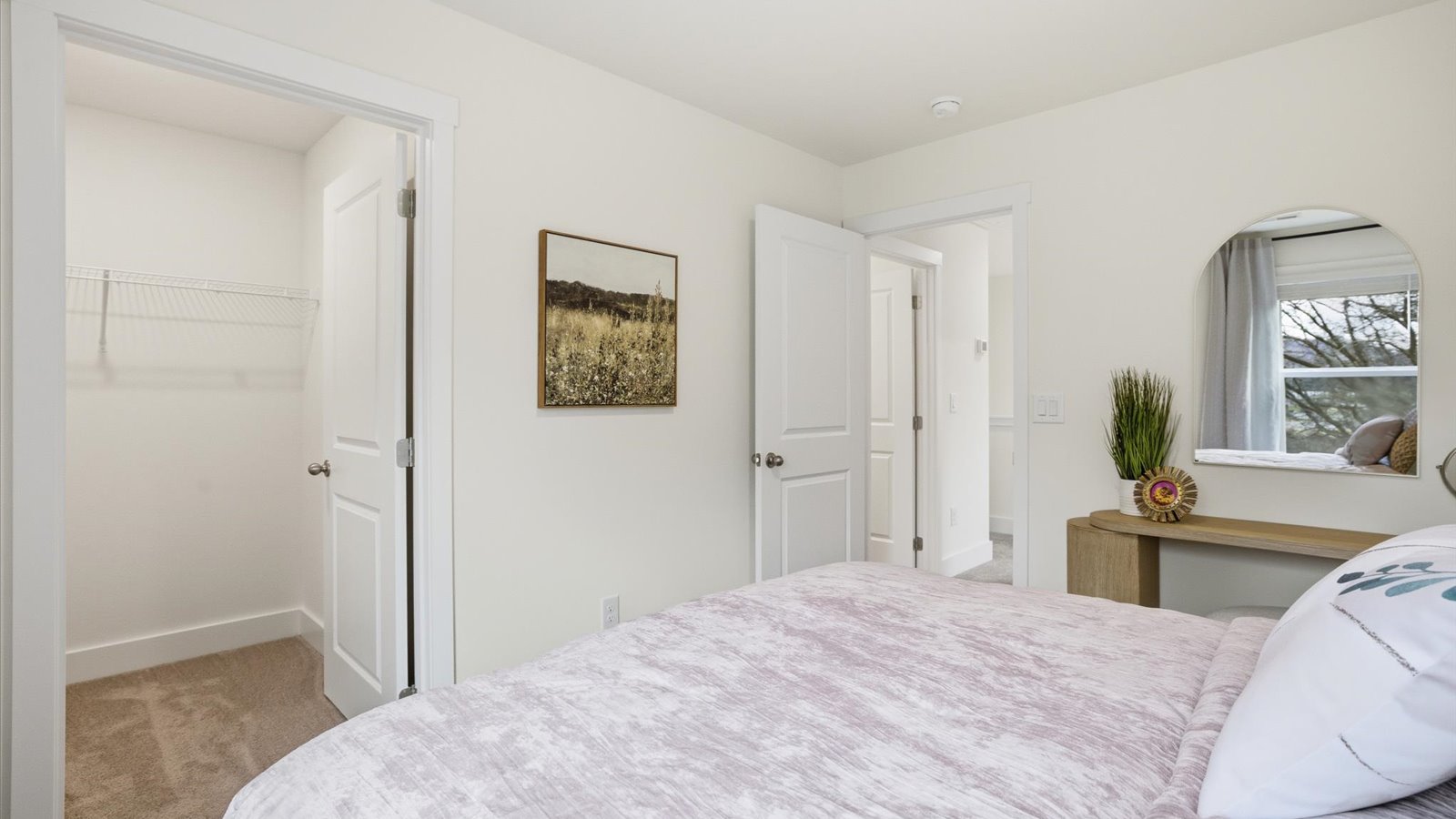 Bedroom with ample natural light and carpet floors