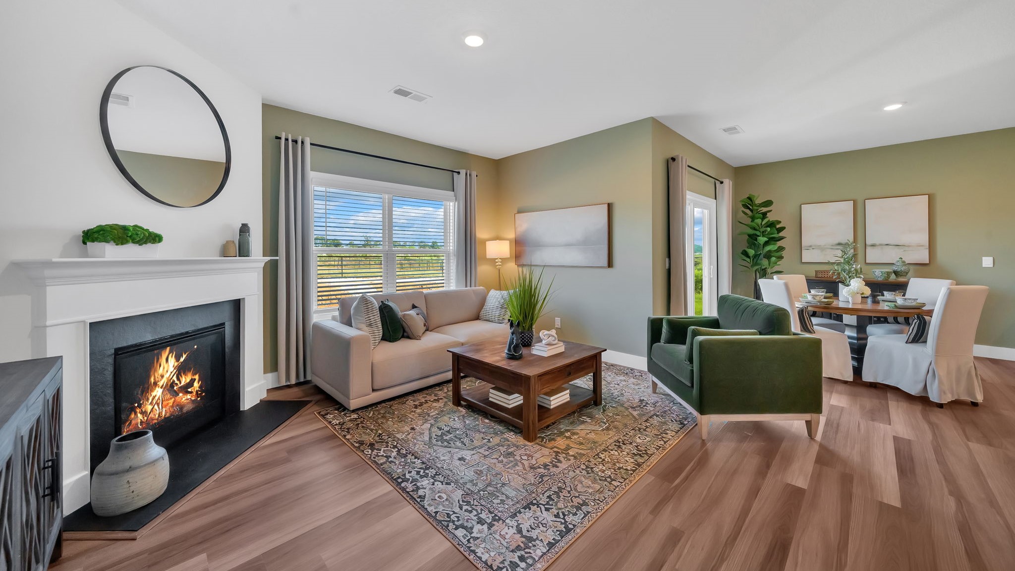 Spacious living and great  room space with light allowing windows