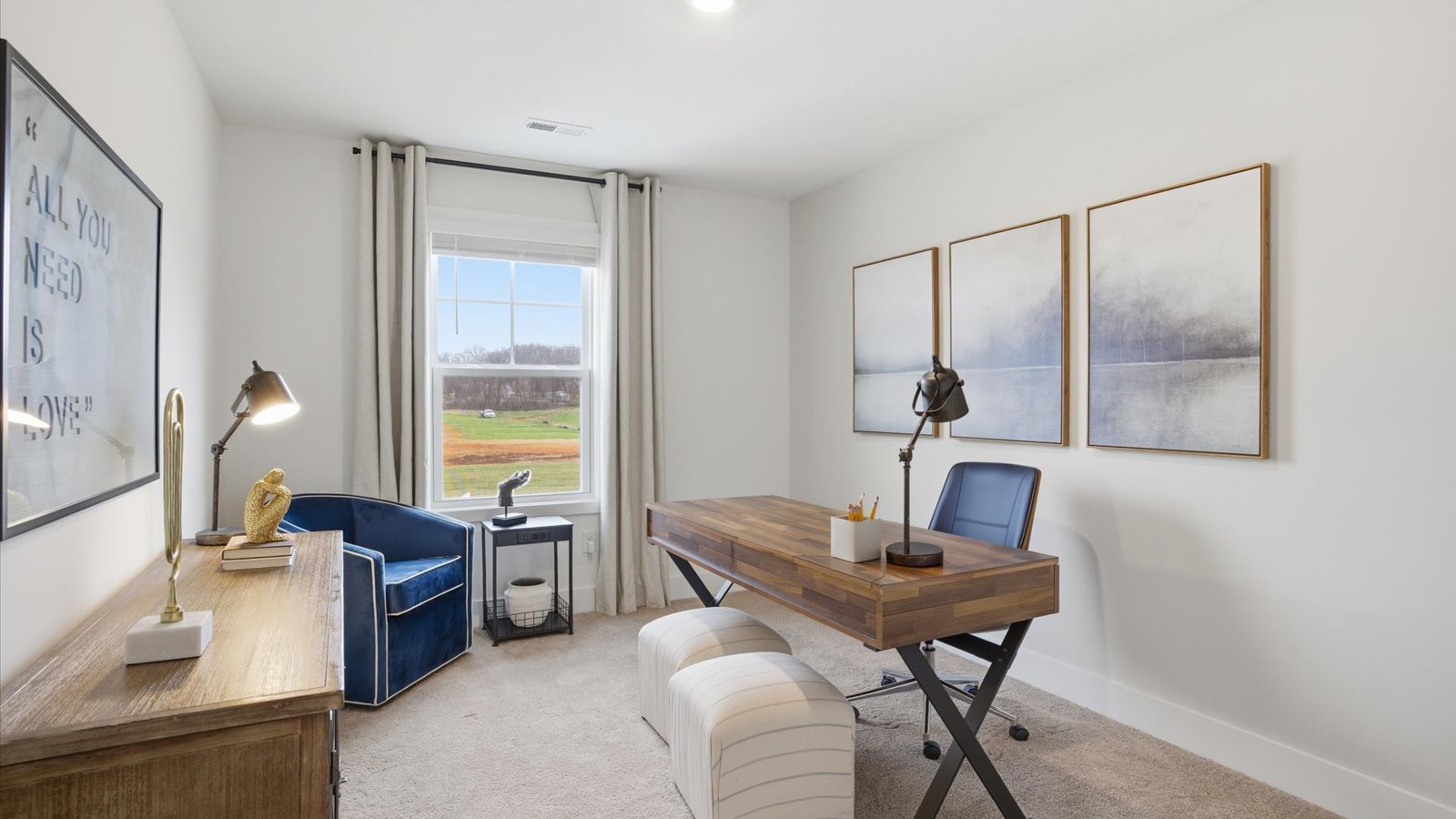 Bedroom with ample natural light and carpet floors