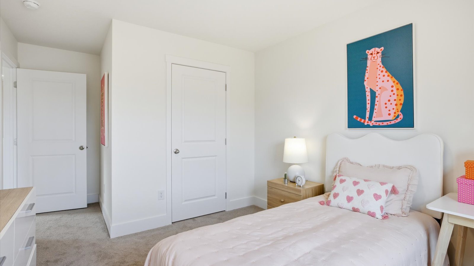 Bedroom with ample natural light and carpet floors