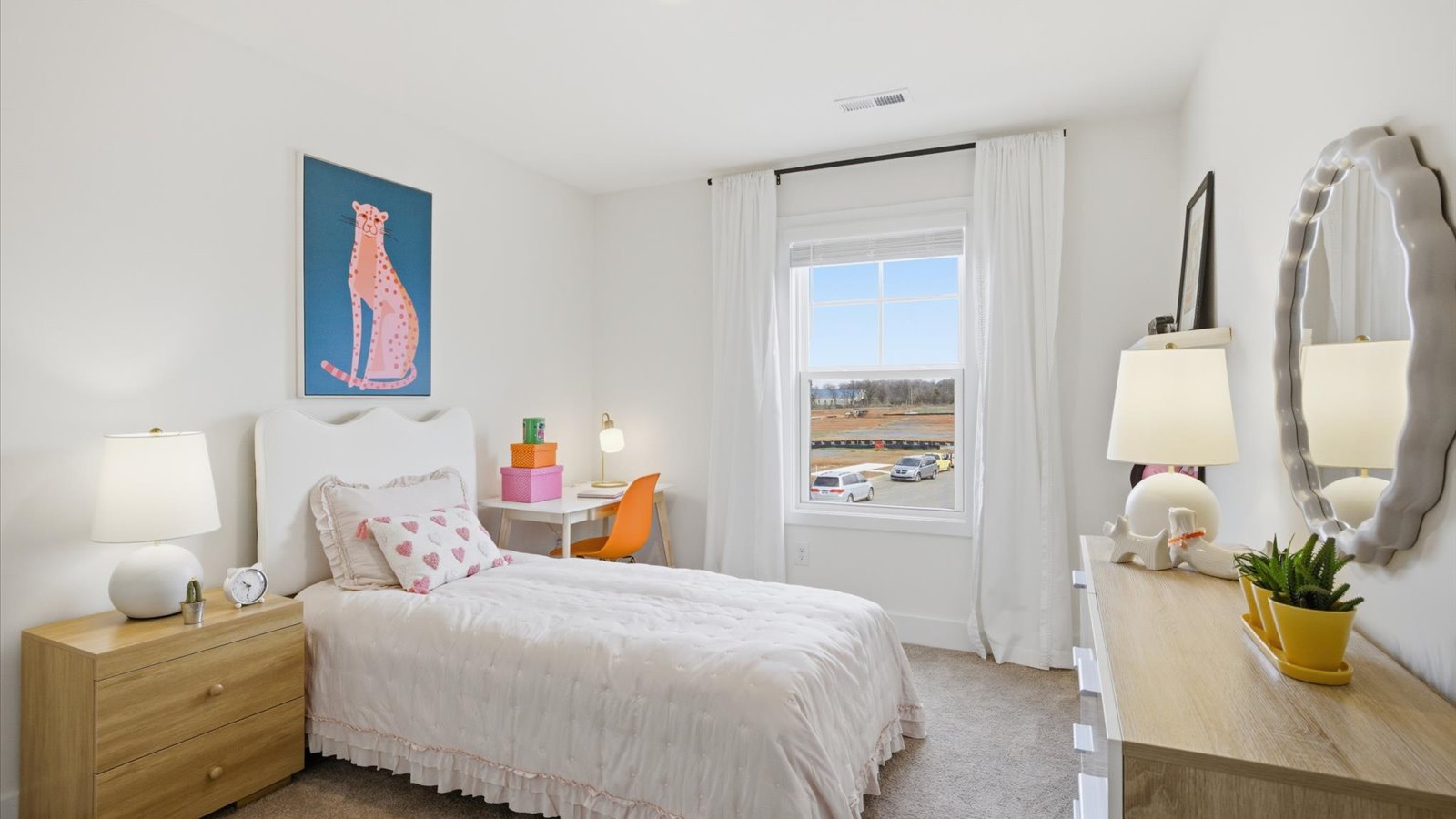 Bedroom with ample natural light and carpet floors