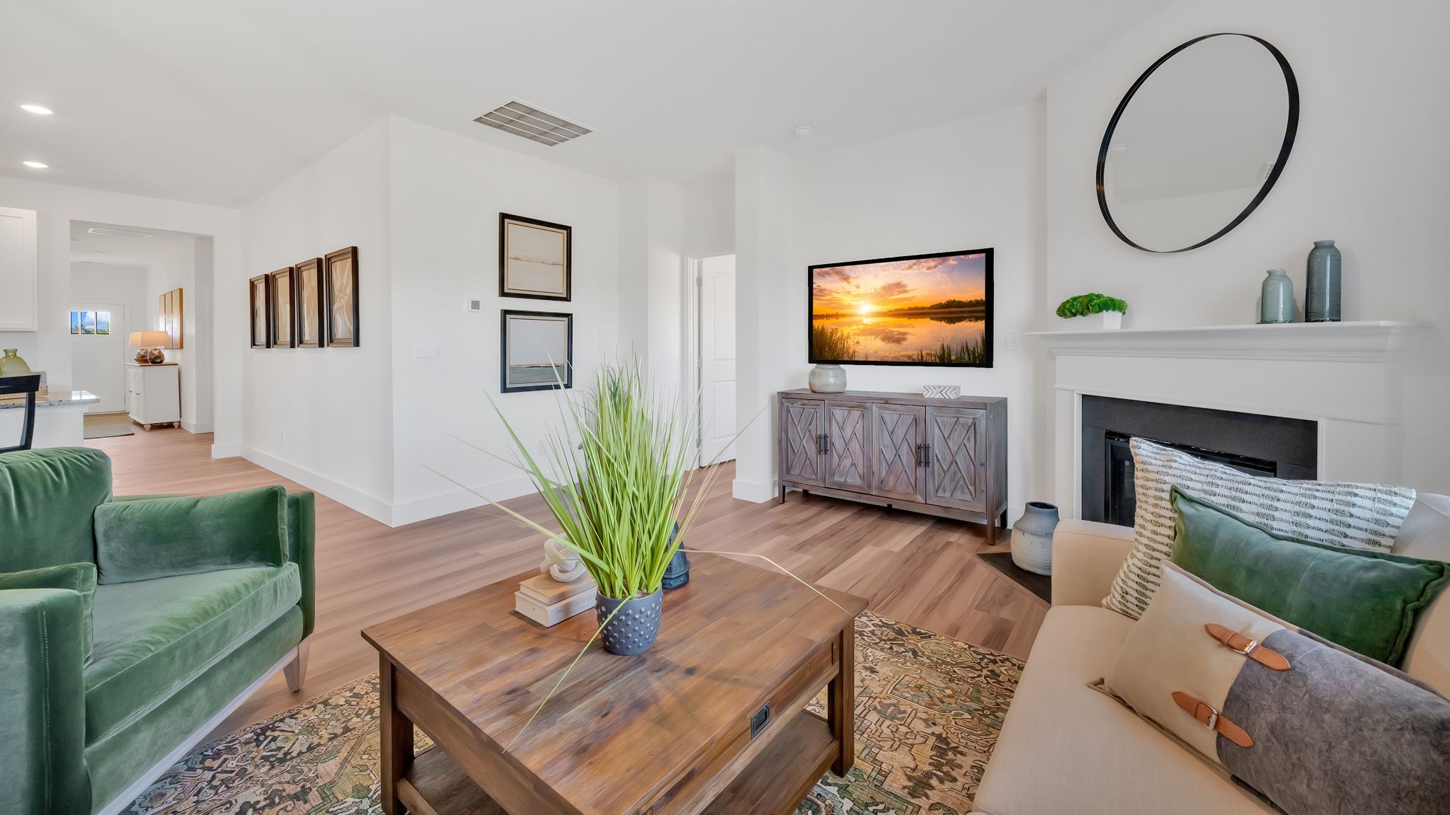 Spacious living and great  room space with light allowing windows