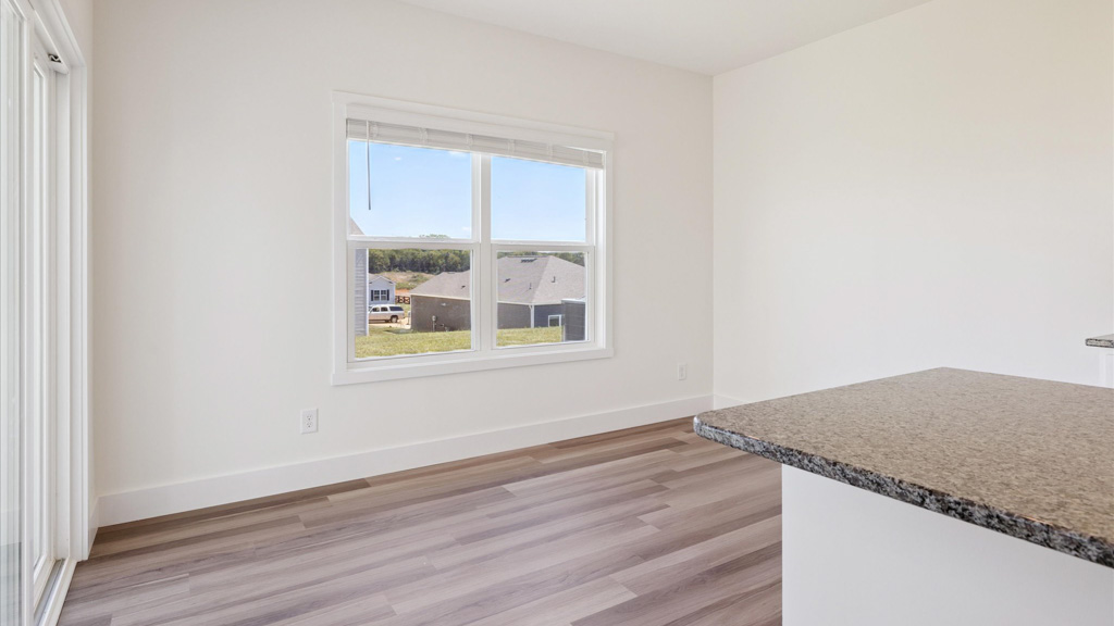 Open concept living, dining, and kitchen space