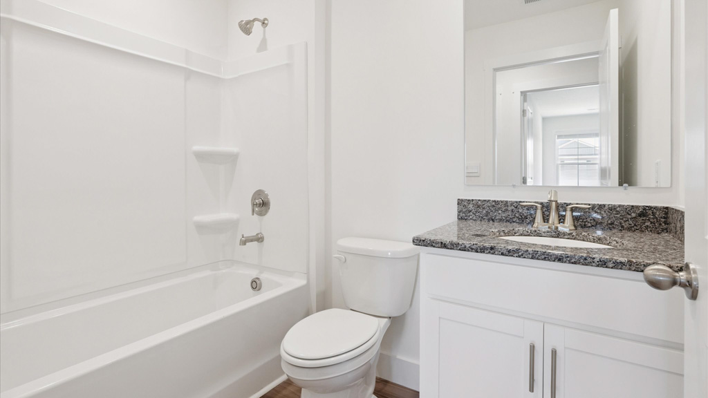 Upstairs bathroom with combination shower and bathtub