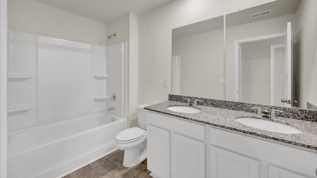 Upstairs bathroom with combination shower and bathtub