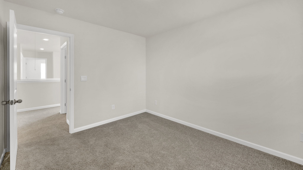 Bedroom with ample natural light and carpet floors
