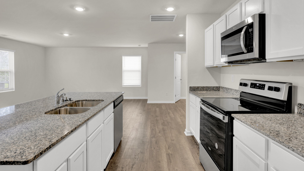 Open concept living, dining, and kitchen space