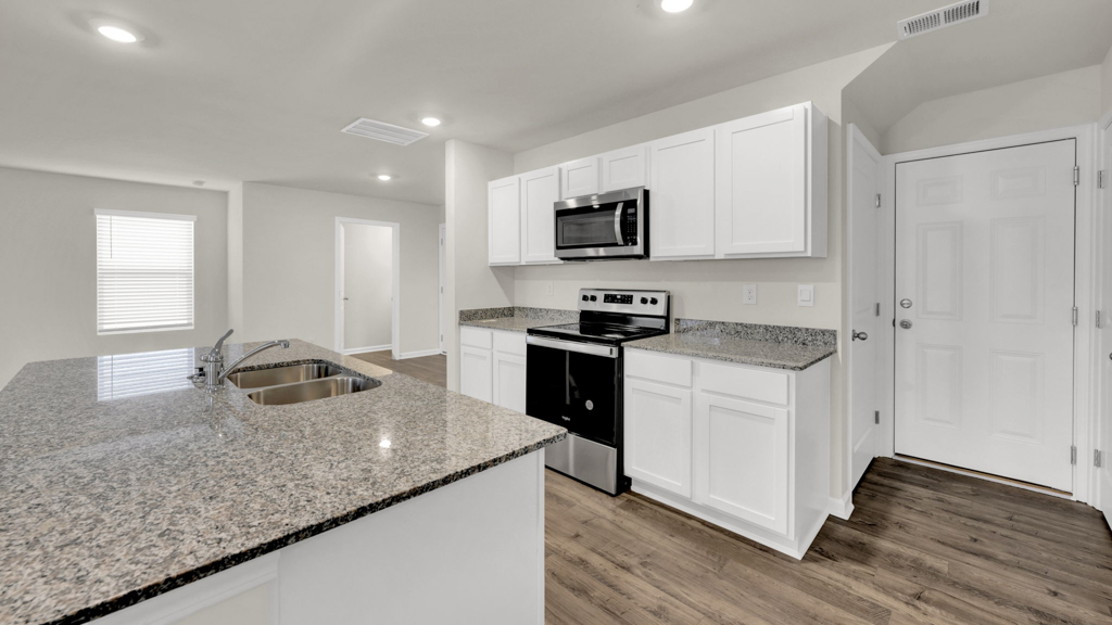 Open concept kitchen, living, family, and dining room space