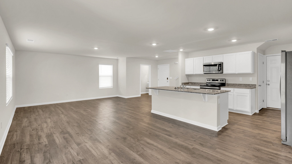 Open concept kitchen, living, family, and dining room space