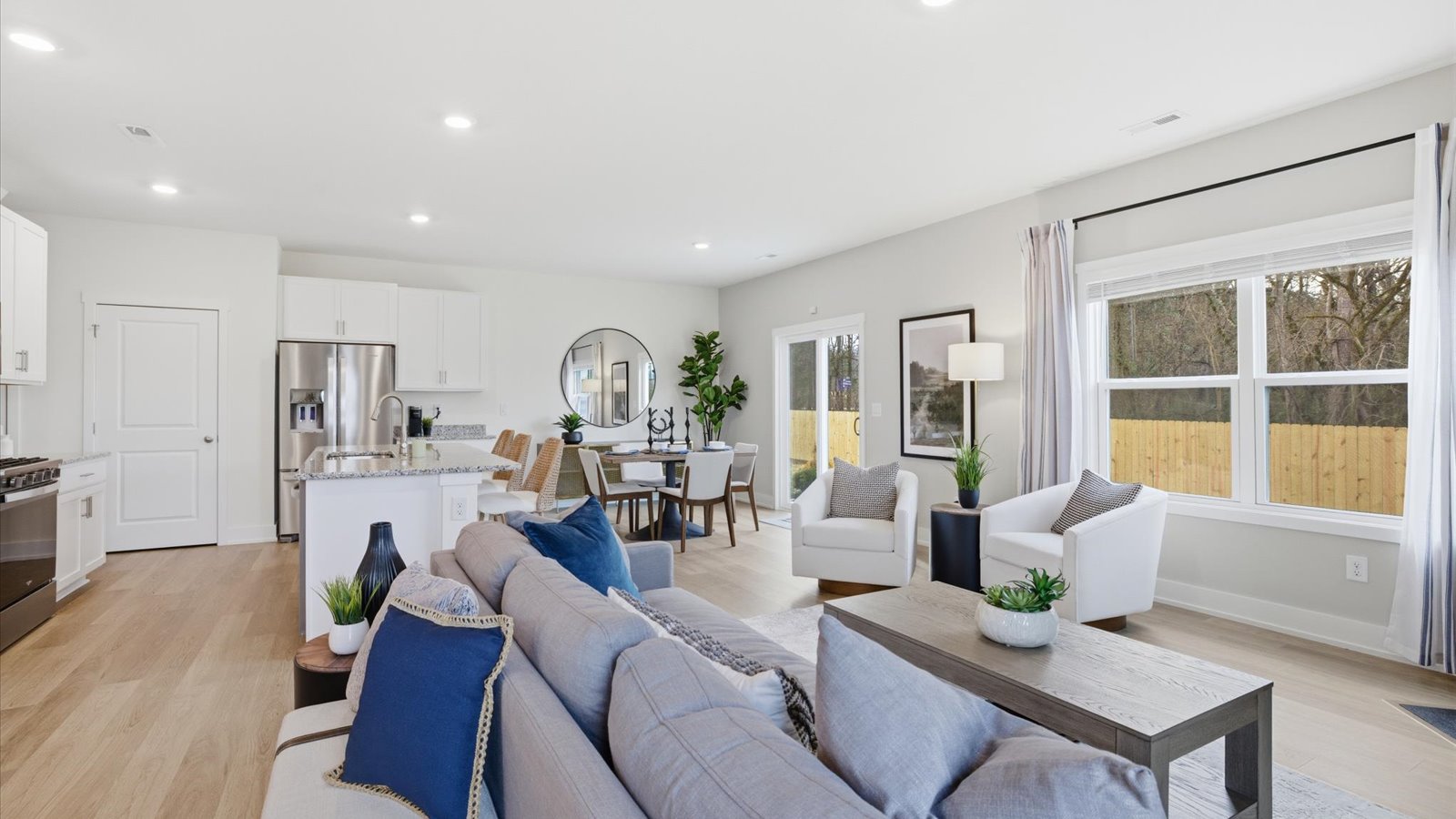 Open concept living, dining, and kitchen space