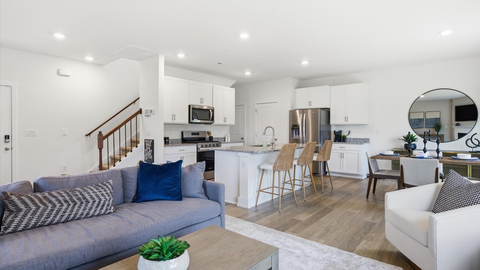 Open concept living, dining, and kitchen space