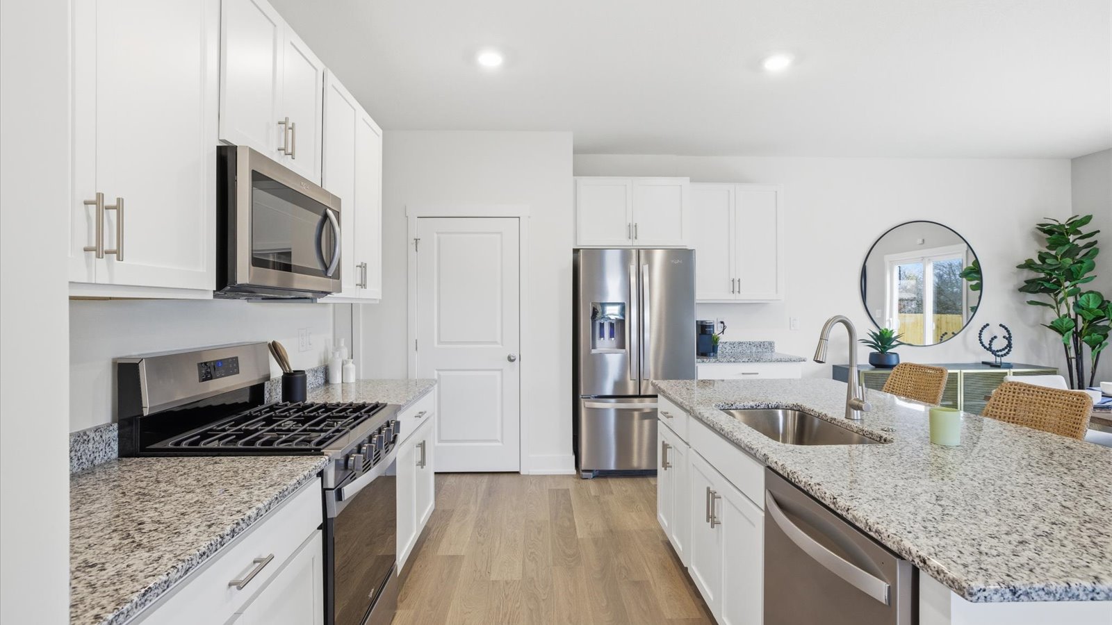 Open concept living, dining, and kitchen space