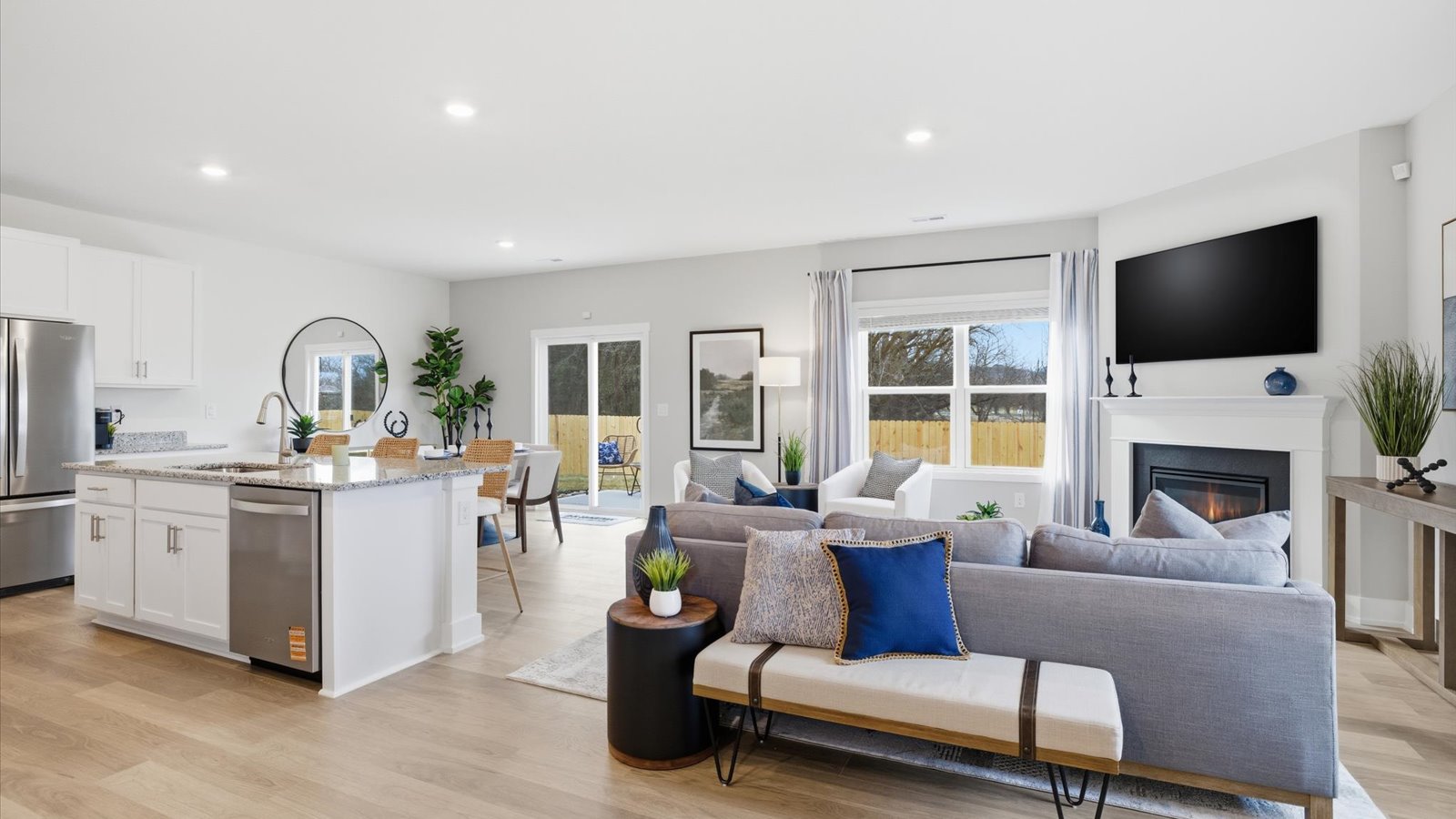 Open concept living, dining, and kitchen space