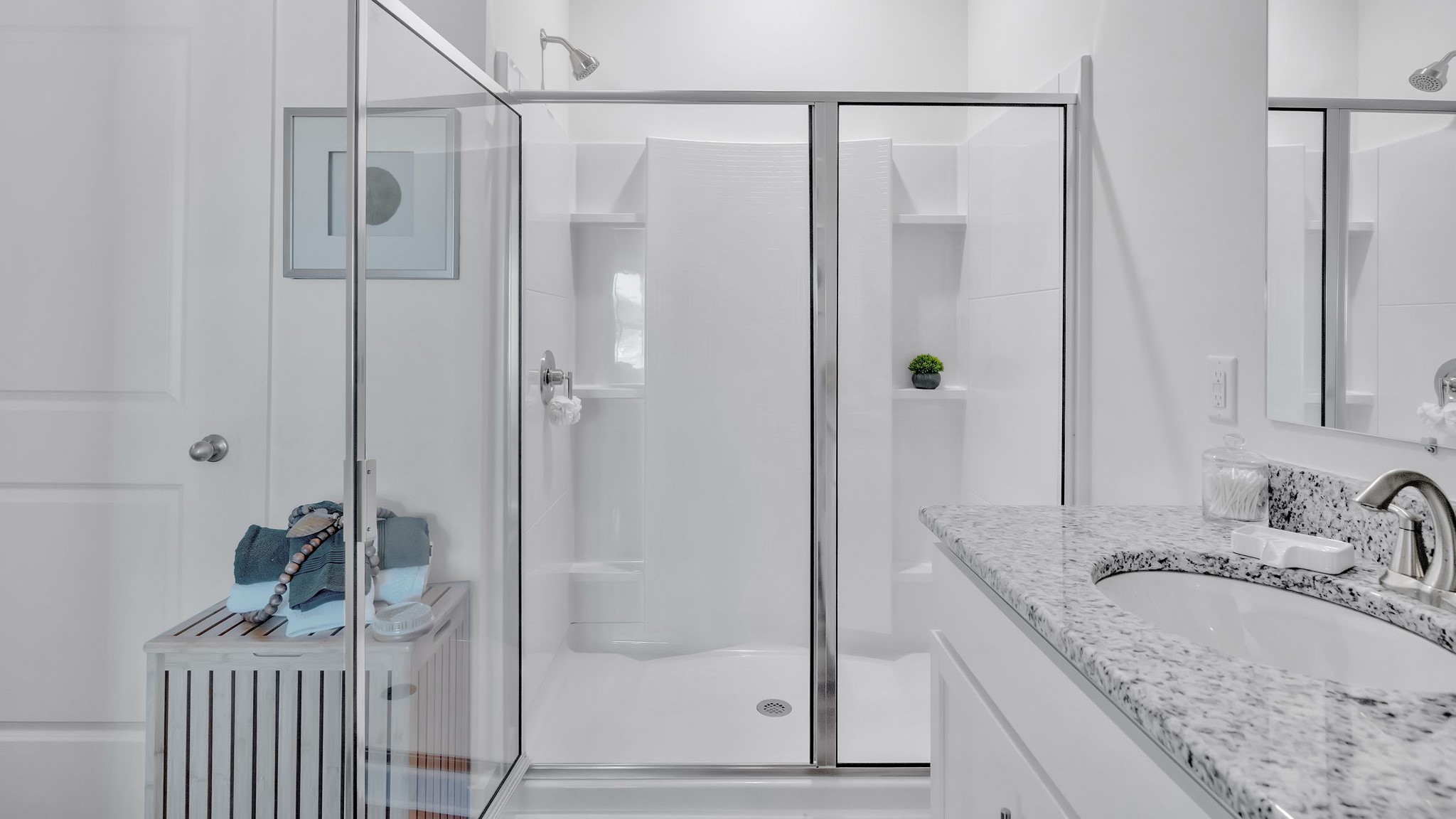 Private attached primary bathroom with built in vanity