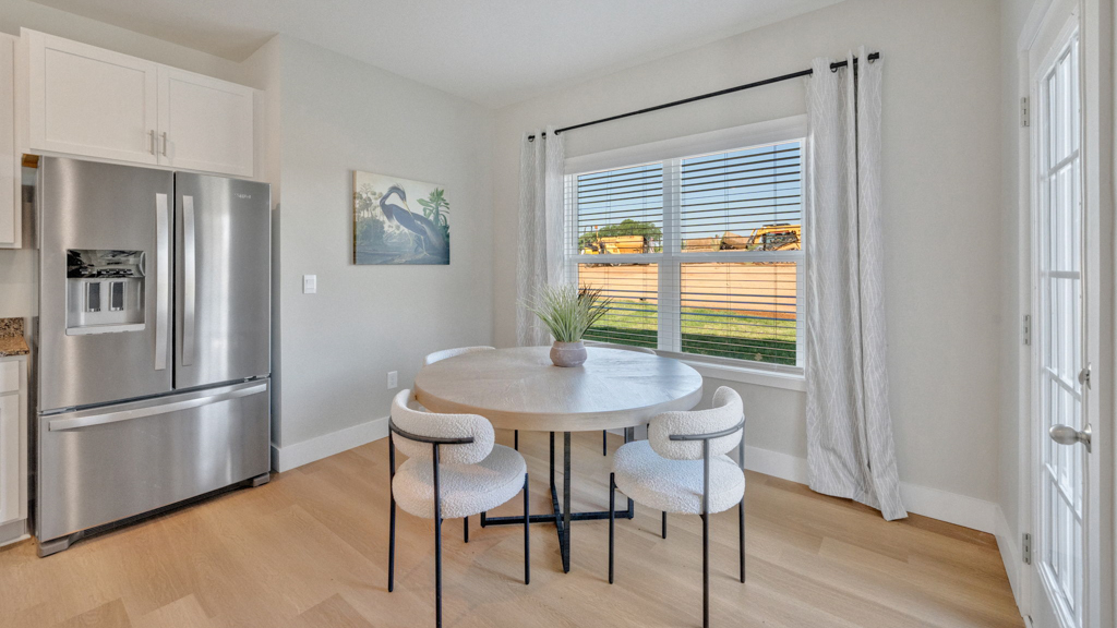 View from living room to front entry, garage acces and home connectivity showcasing our open designs at Price's Point