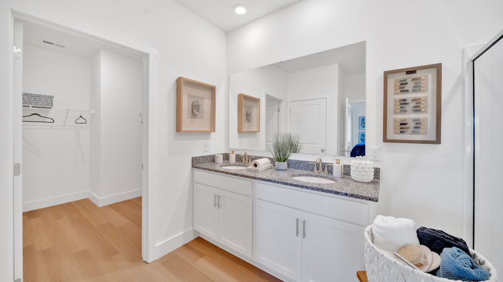 Owner’s ensuite in a new build home offers function and style with a walk-in closet, spa-like ensuite