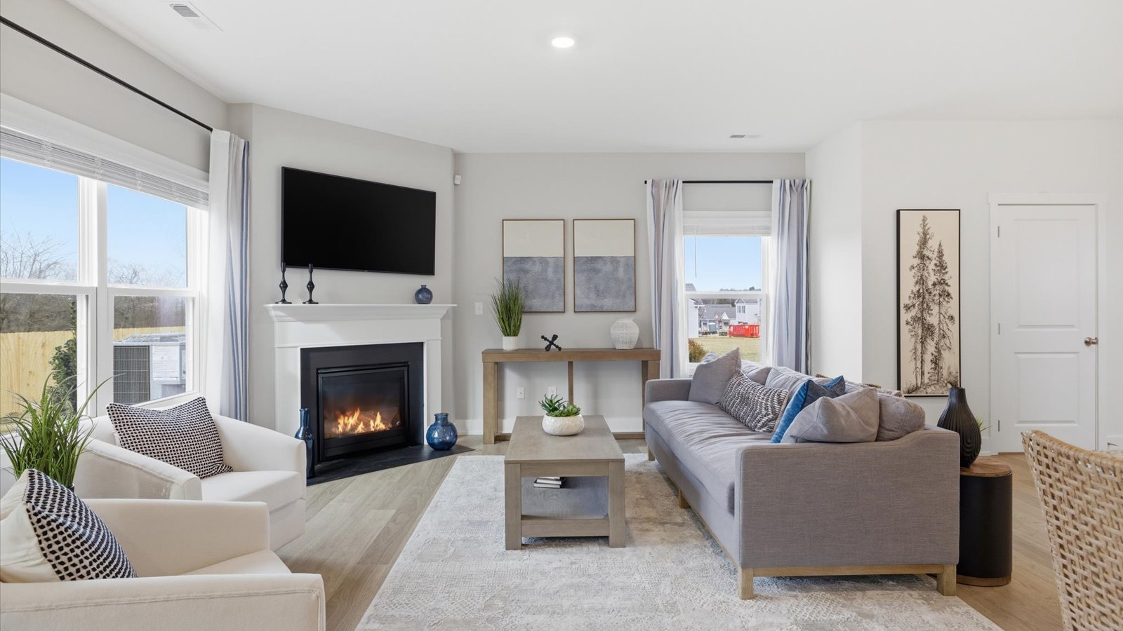 Open concept living, dining, and kitchen space