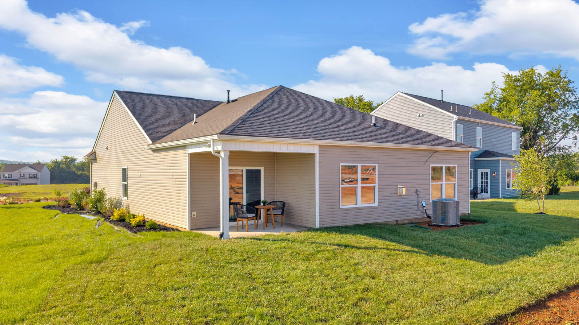 covered patio and lush back yard