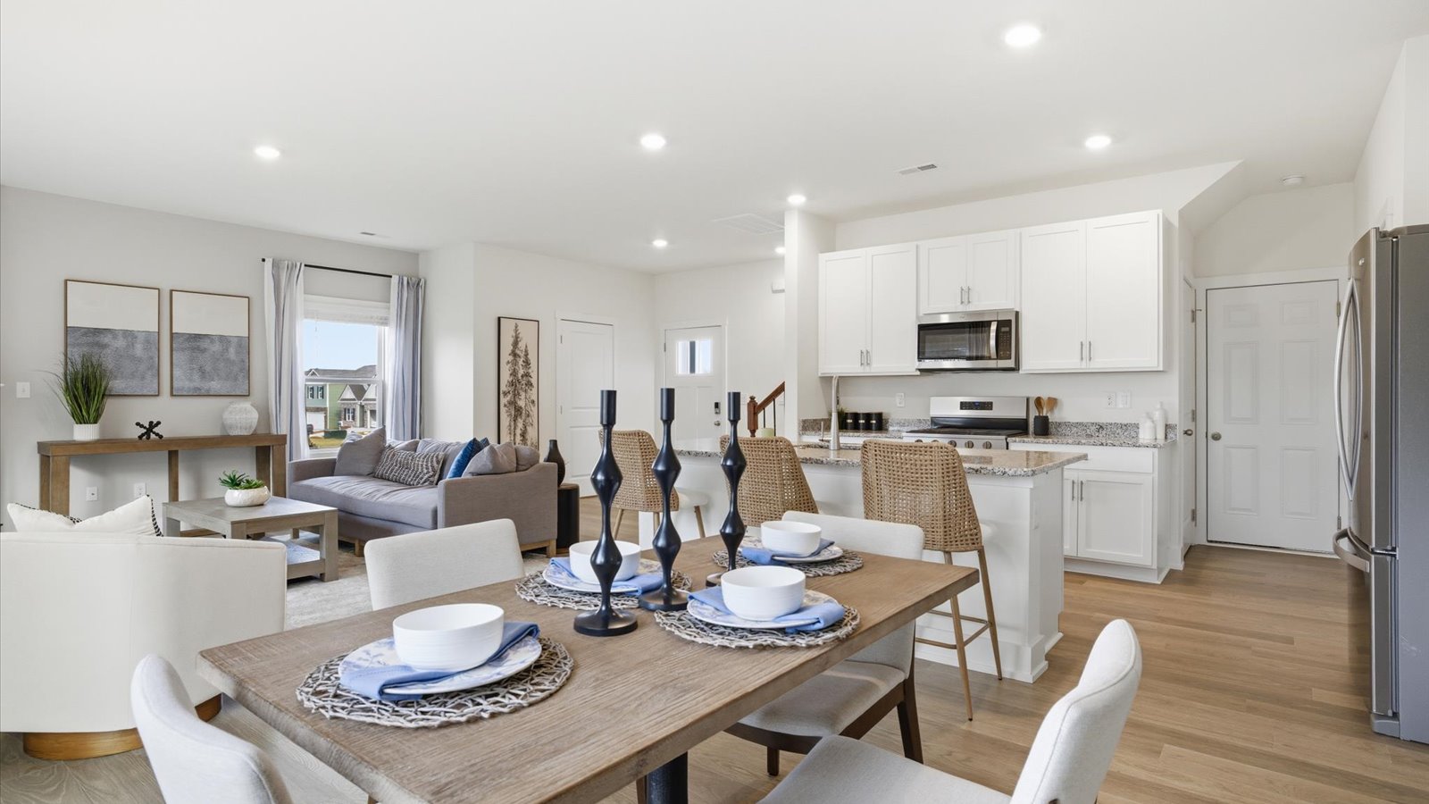 Open concept living, dining, and kitchen space