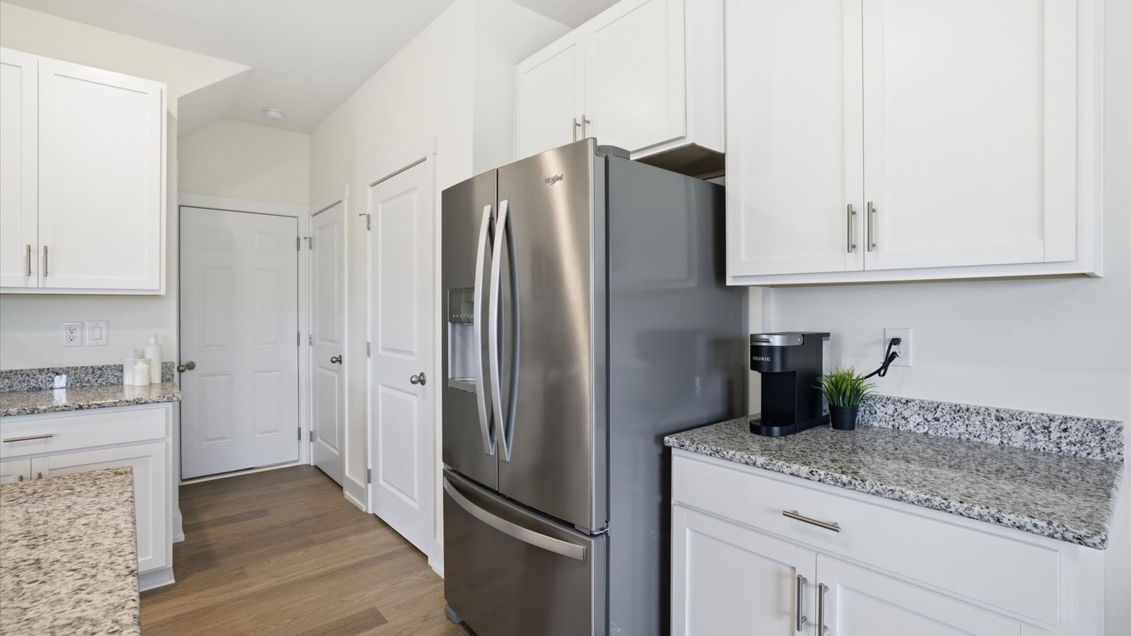 Open concept living, dining, and kitchen space