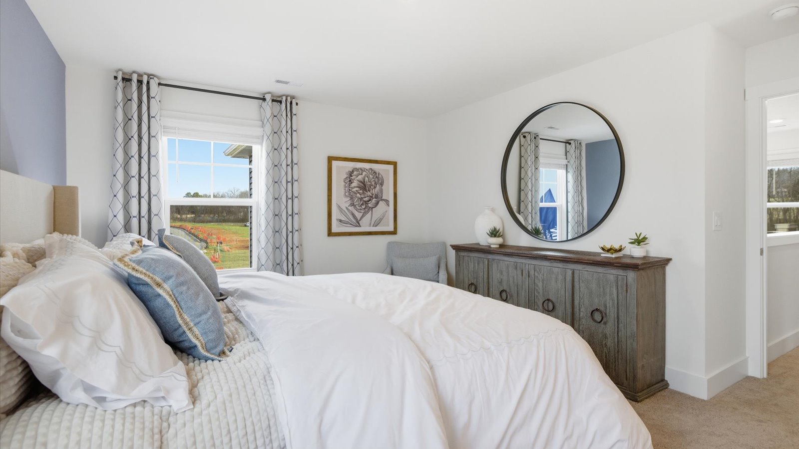 Primary bedroom with private attached bathroom and walk-in closet