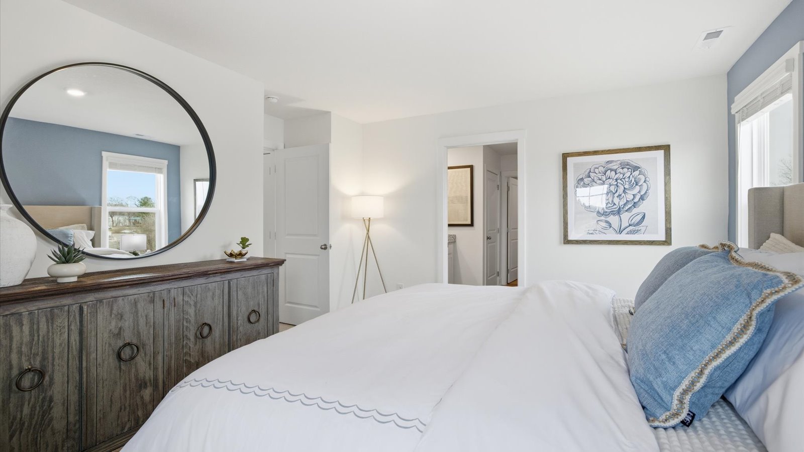 Primary bedroom with private attached bathroom and walk-in closet