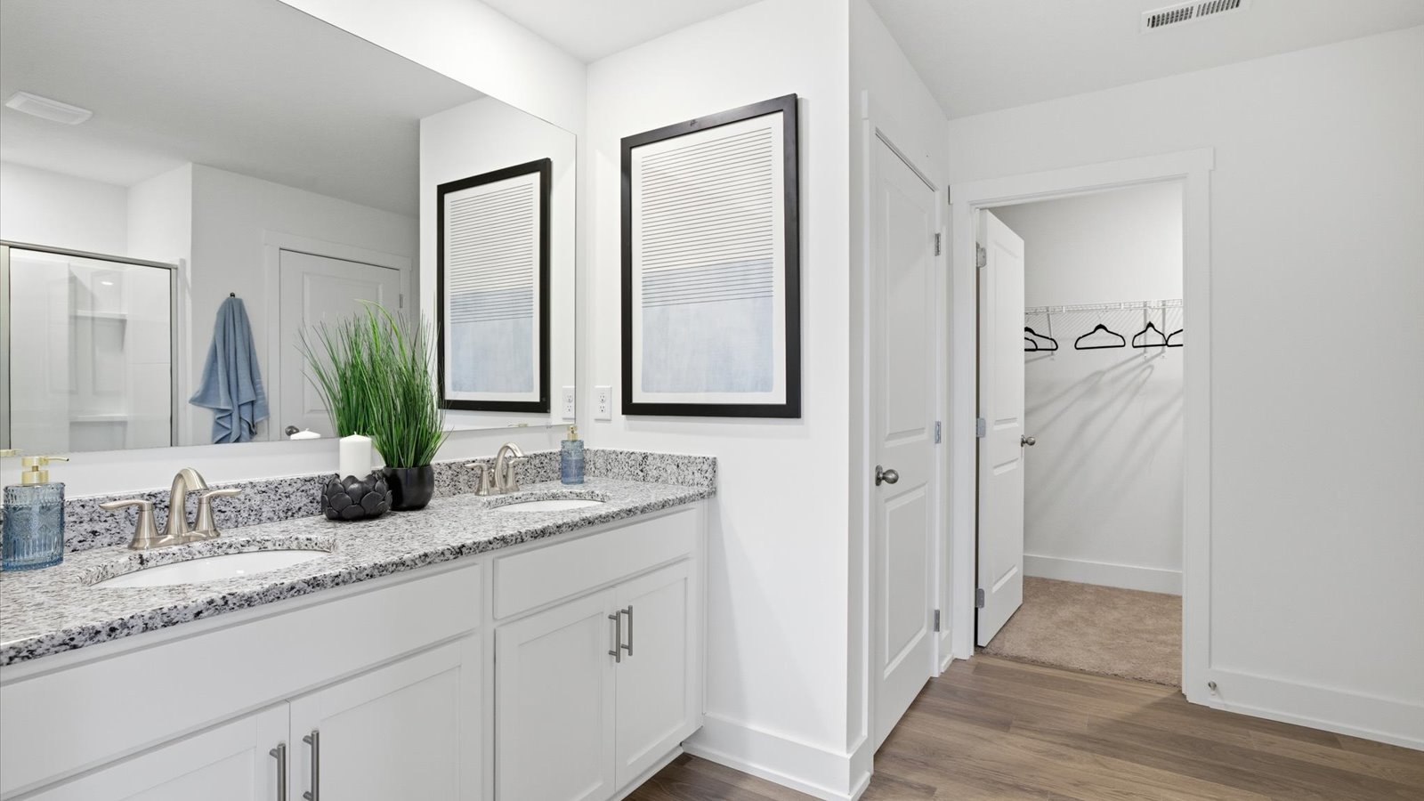 Primary bathroom with double vanity and walk-in shower