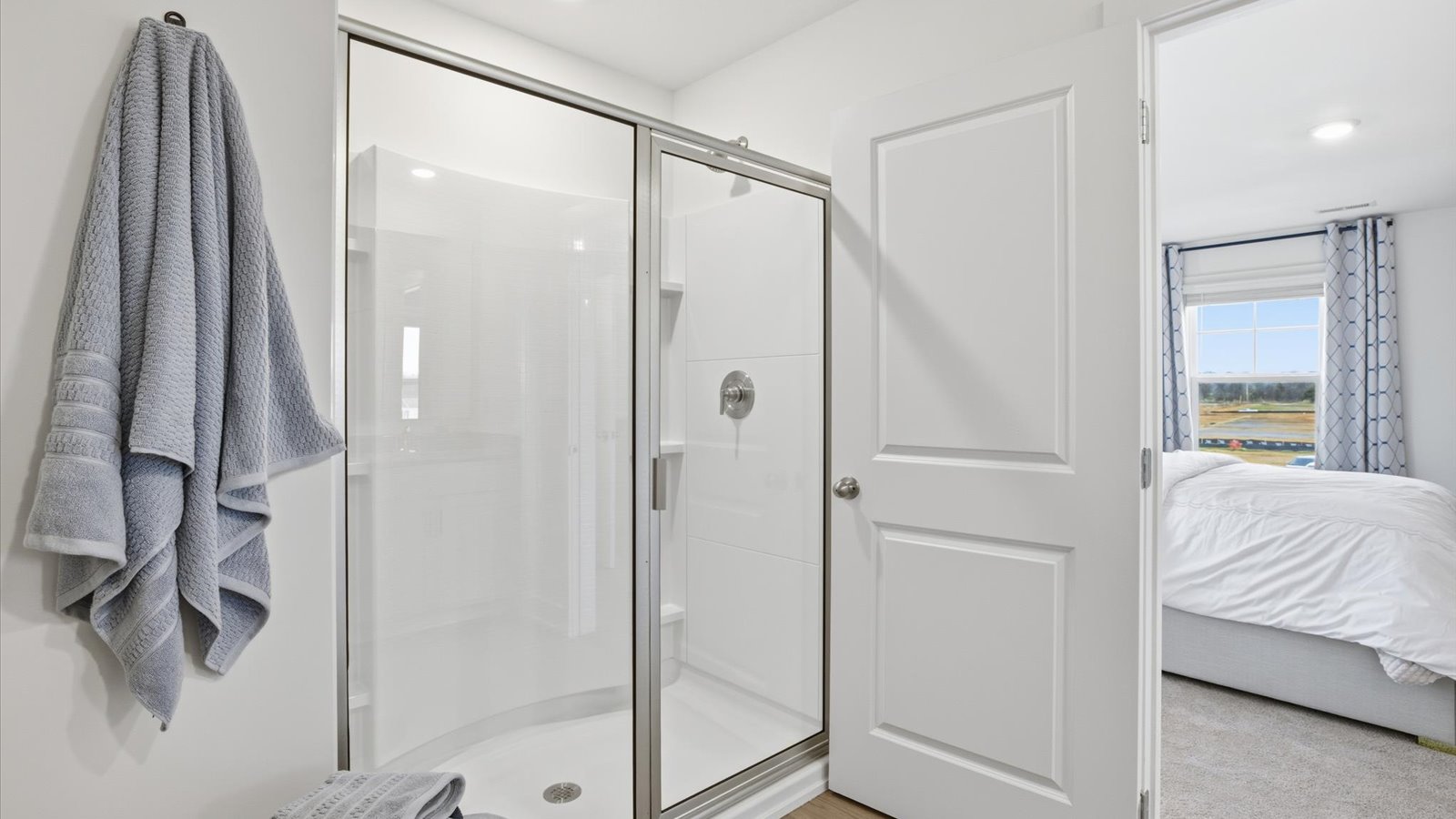 Primary bathroom with double vanity and walk-in shower