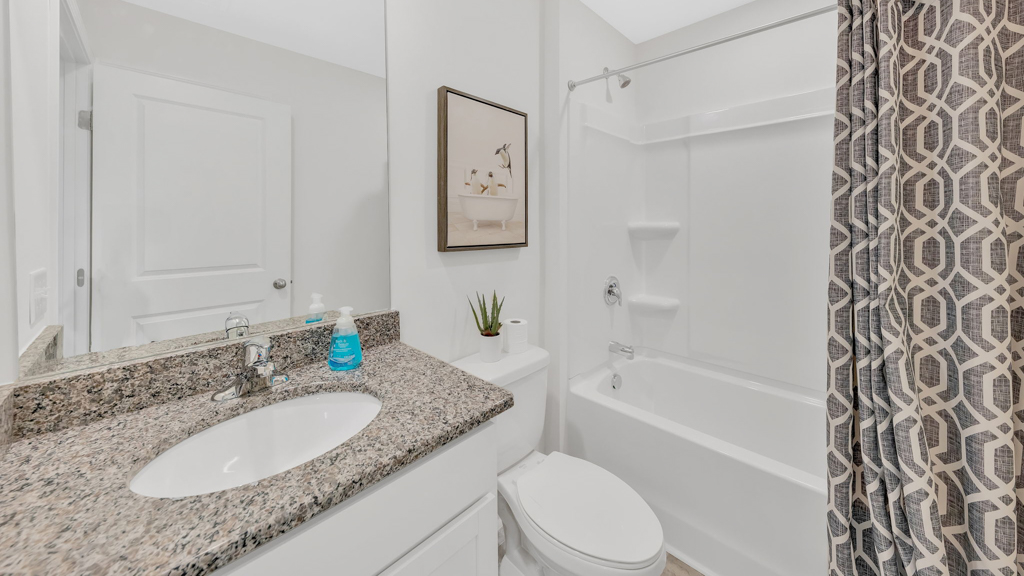 Bathroom with combination shower and bathtub