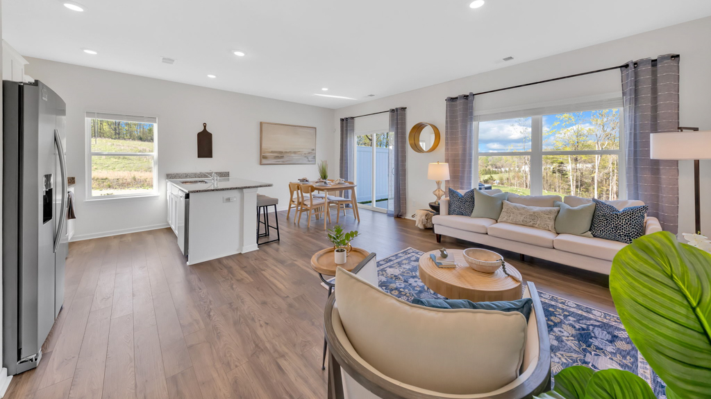 Open concept living, dining, and kitchen space