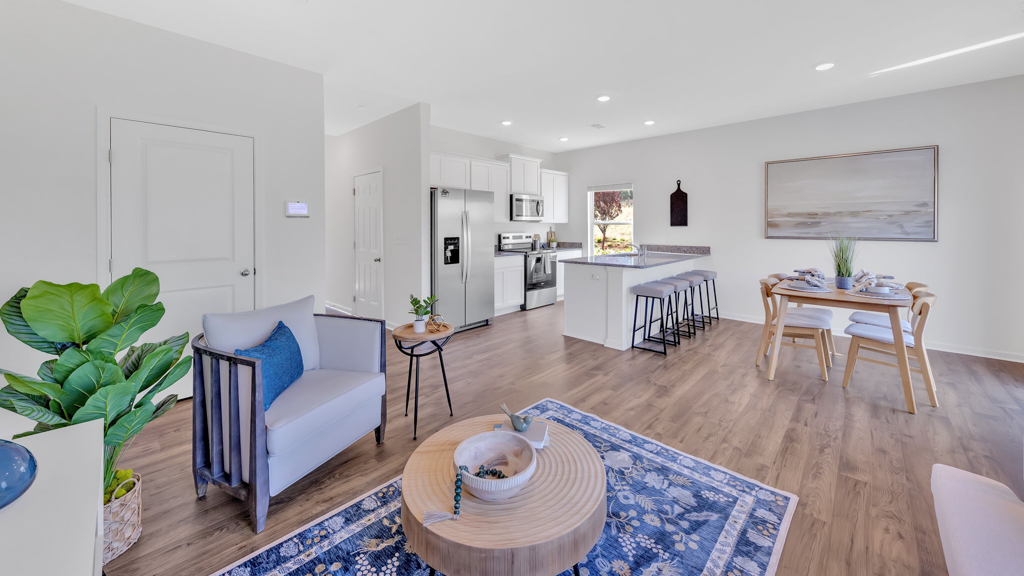 Open concept living, dining, and kitchen space