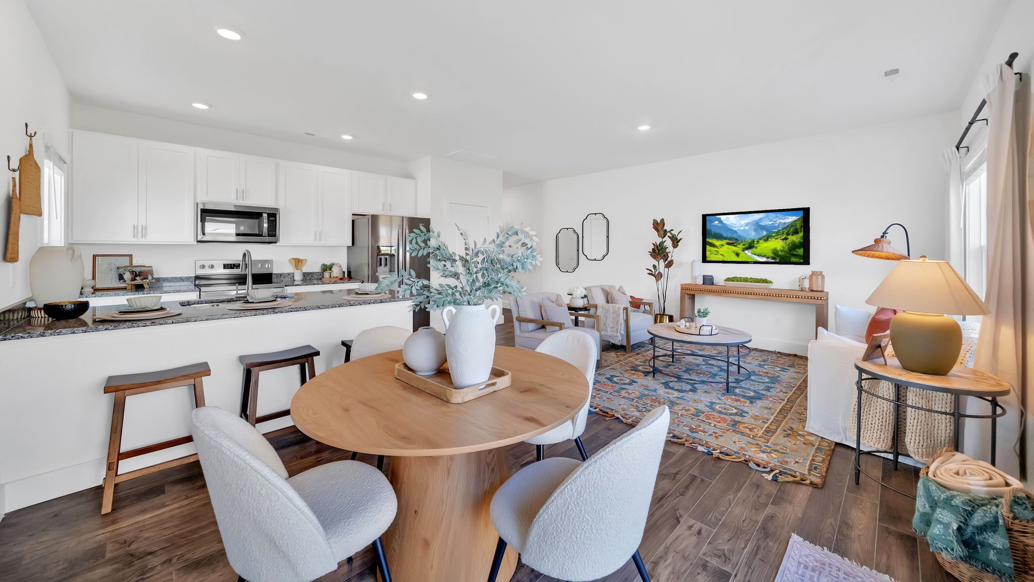 Open concept living, dining, and kitchen space