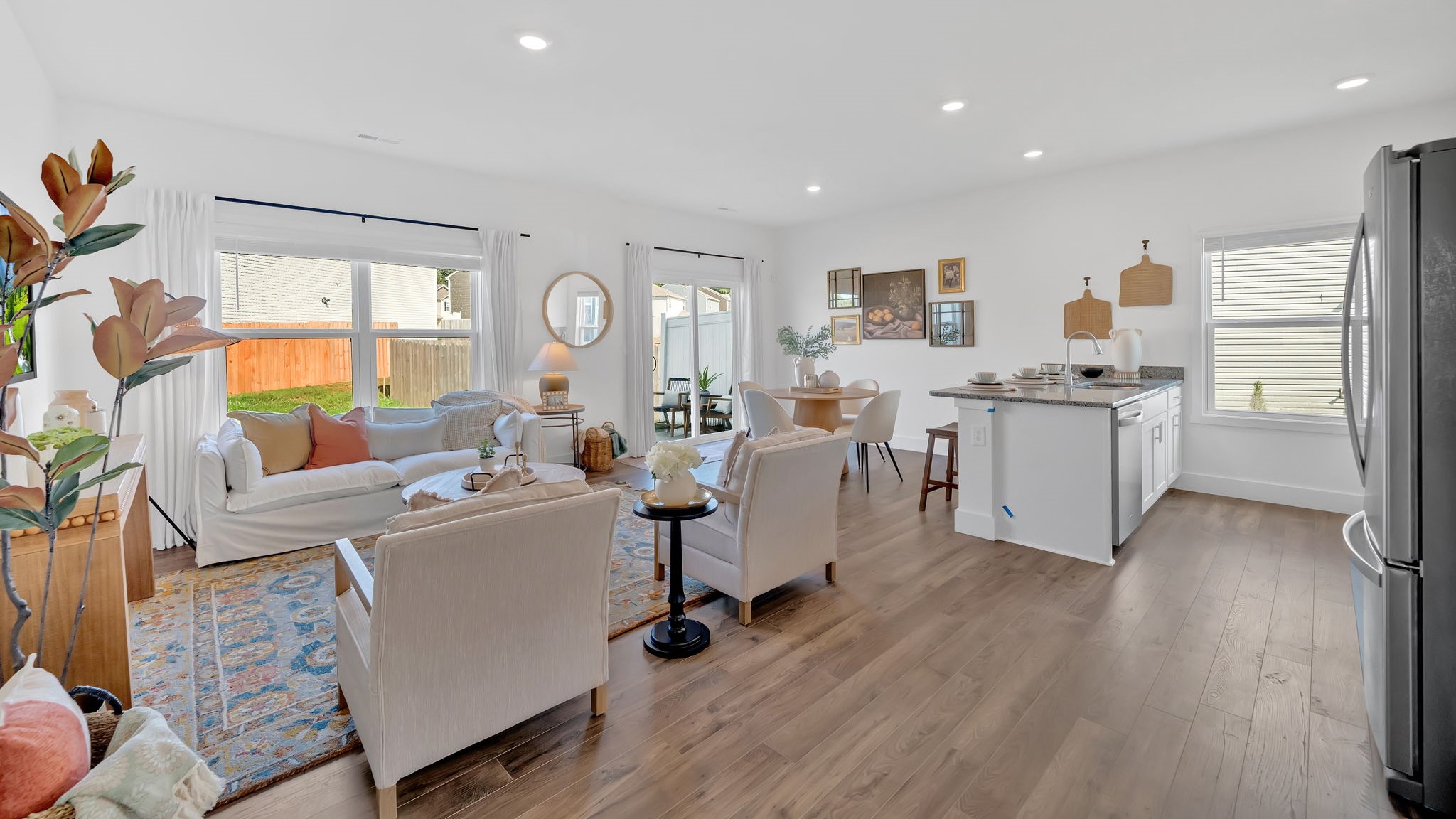 Open concept living, dining, and kitchen space