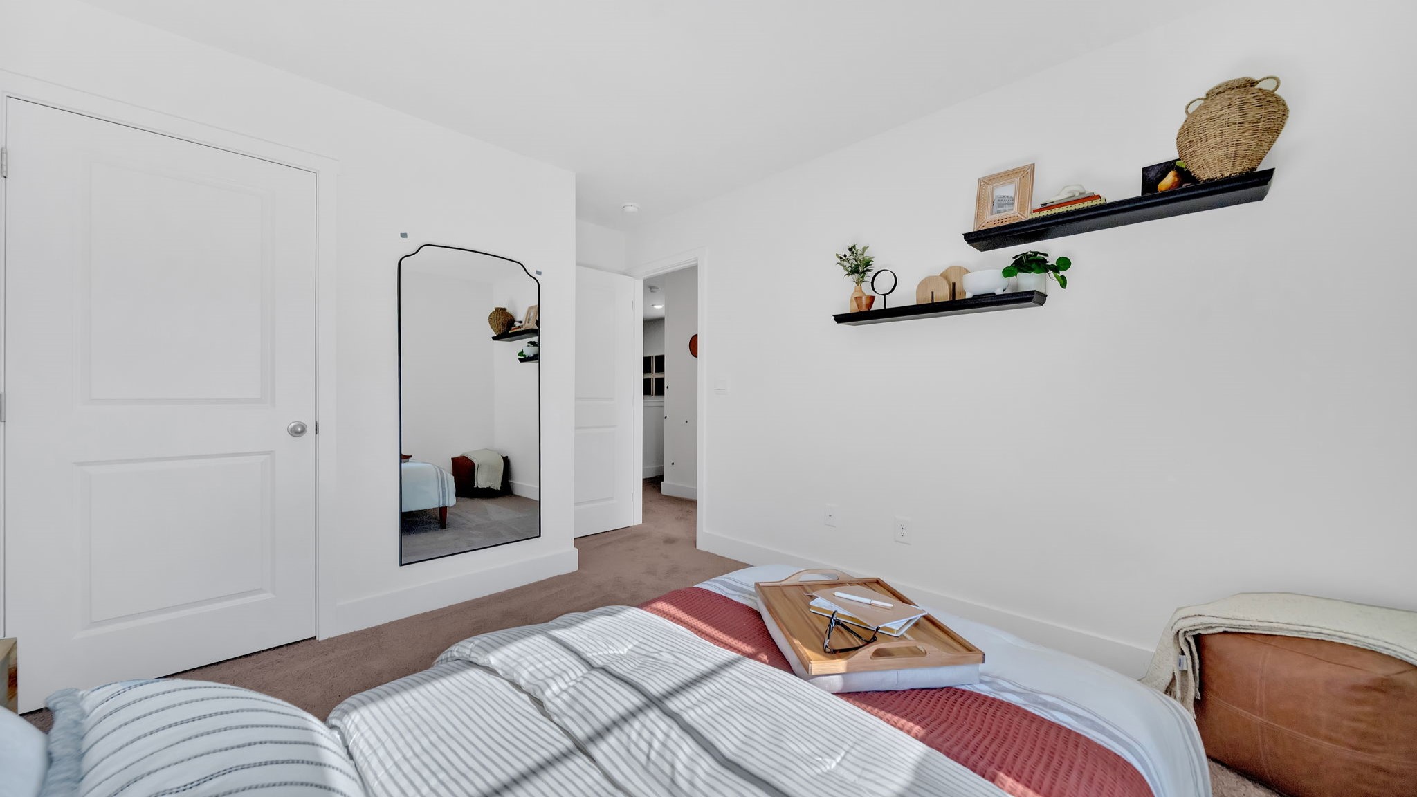Bedroom with ample natural light and carpet floors
