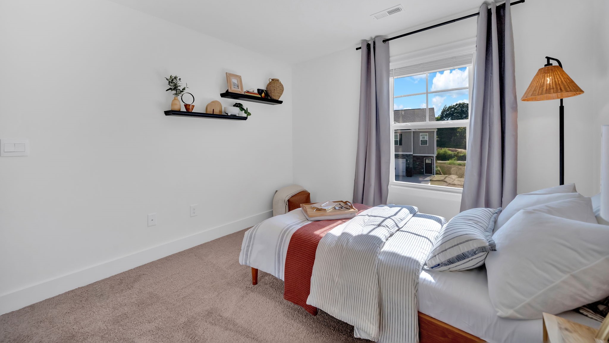 Bedroom with ample natural light and carpet floors