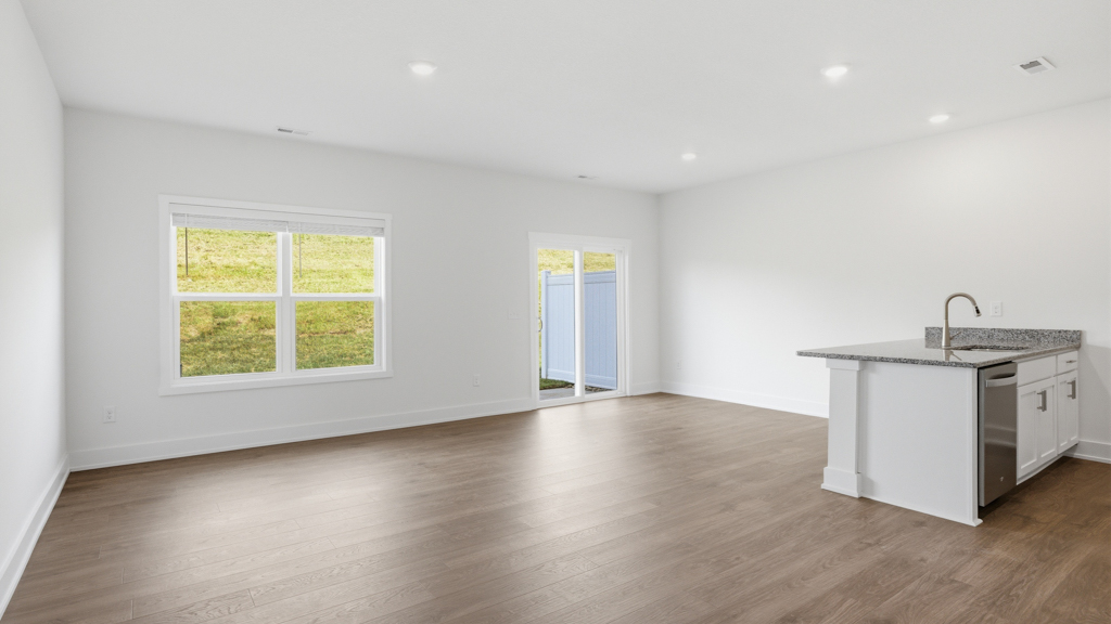 Open concept living, dining, and kitchen space