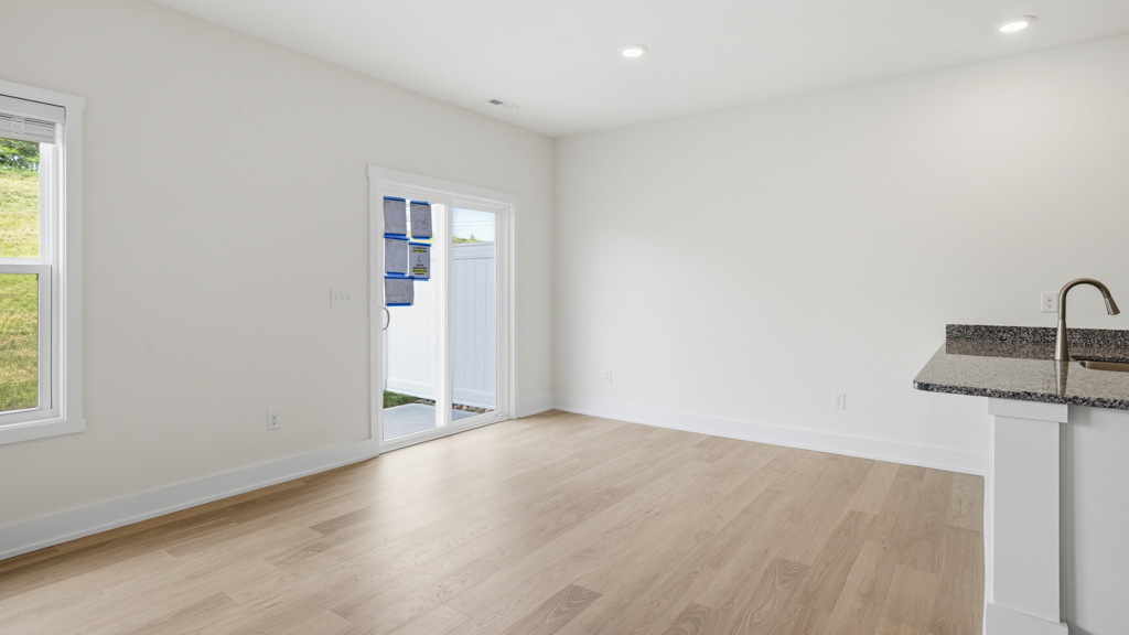 Open concept living, dining, and kitchen space