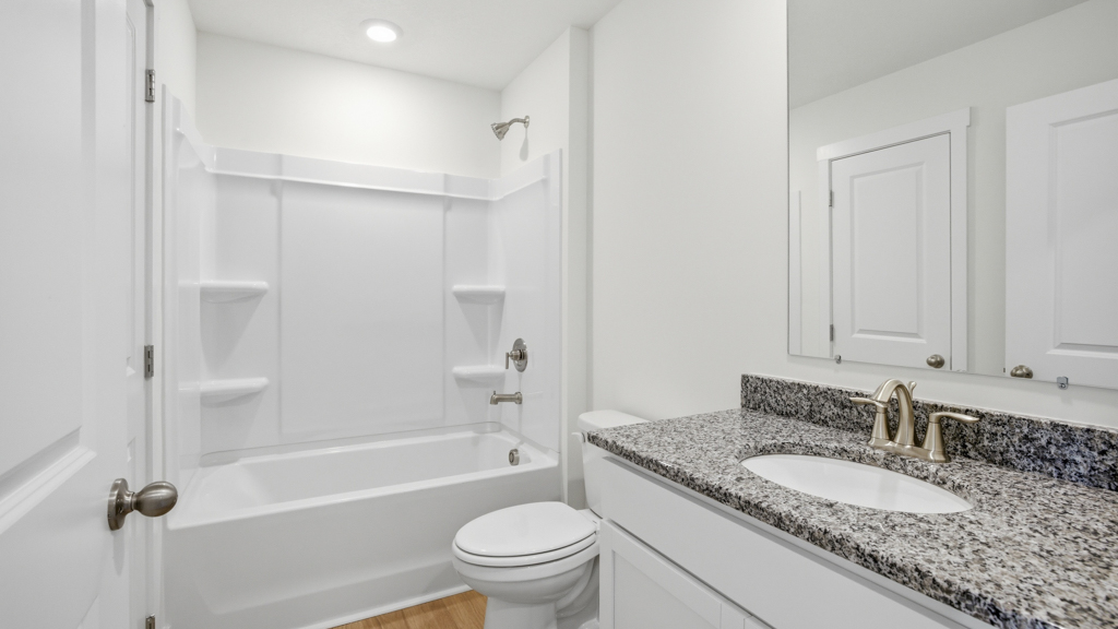 Guest bathroom with built in vanity and combination bathtub shower