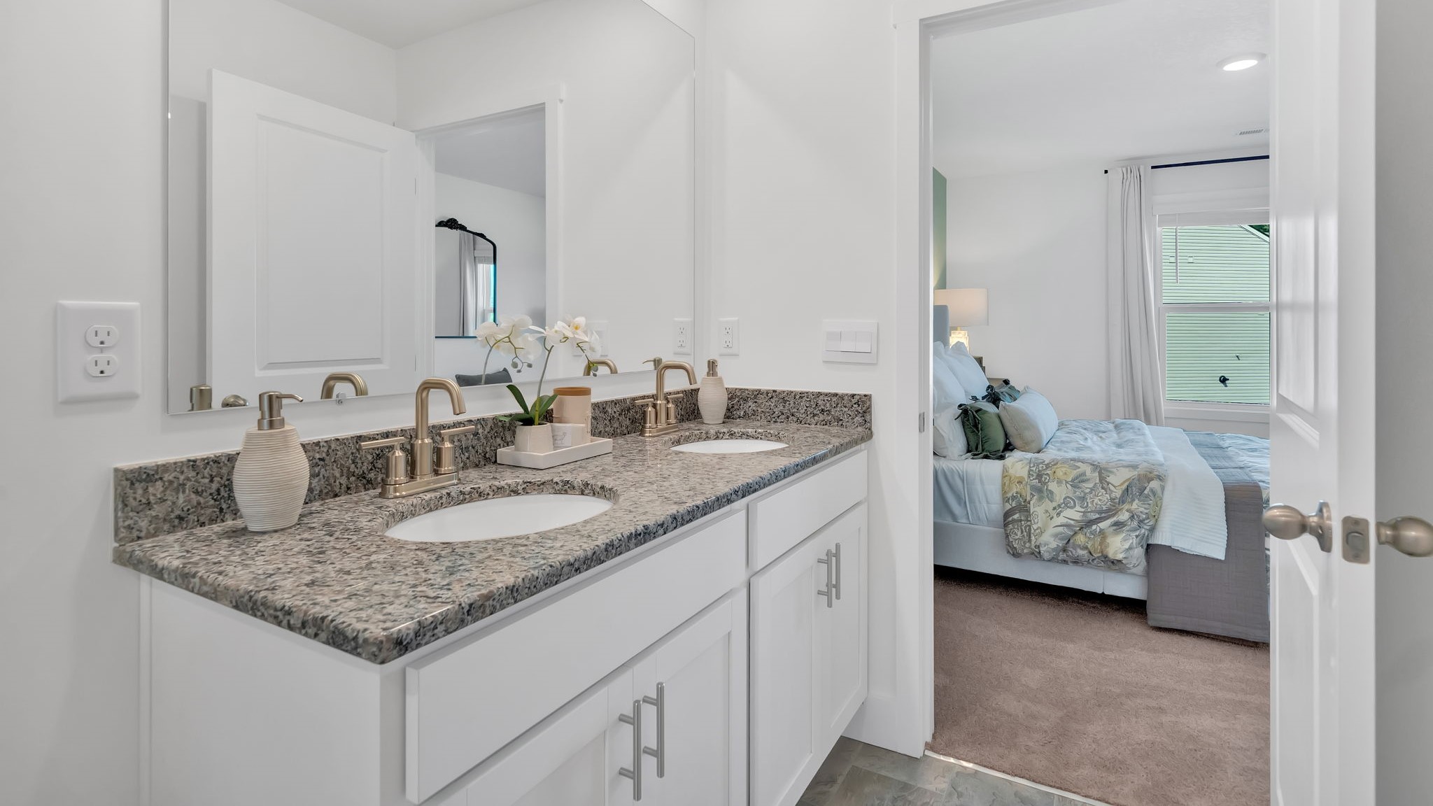 Private attached primary bathroom with built in vanity