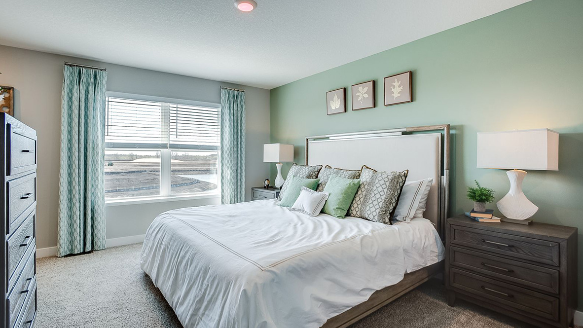 Primary bedroom brings privacy and style adding a spa-inspired ensuite bathroom, walk-in closet, storage Amberglen By D.R. Horton