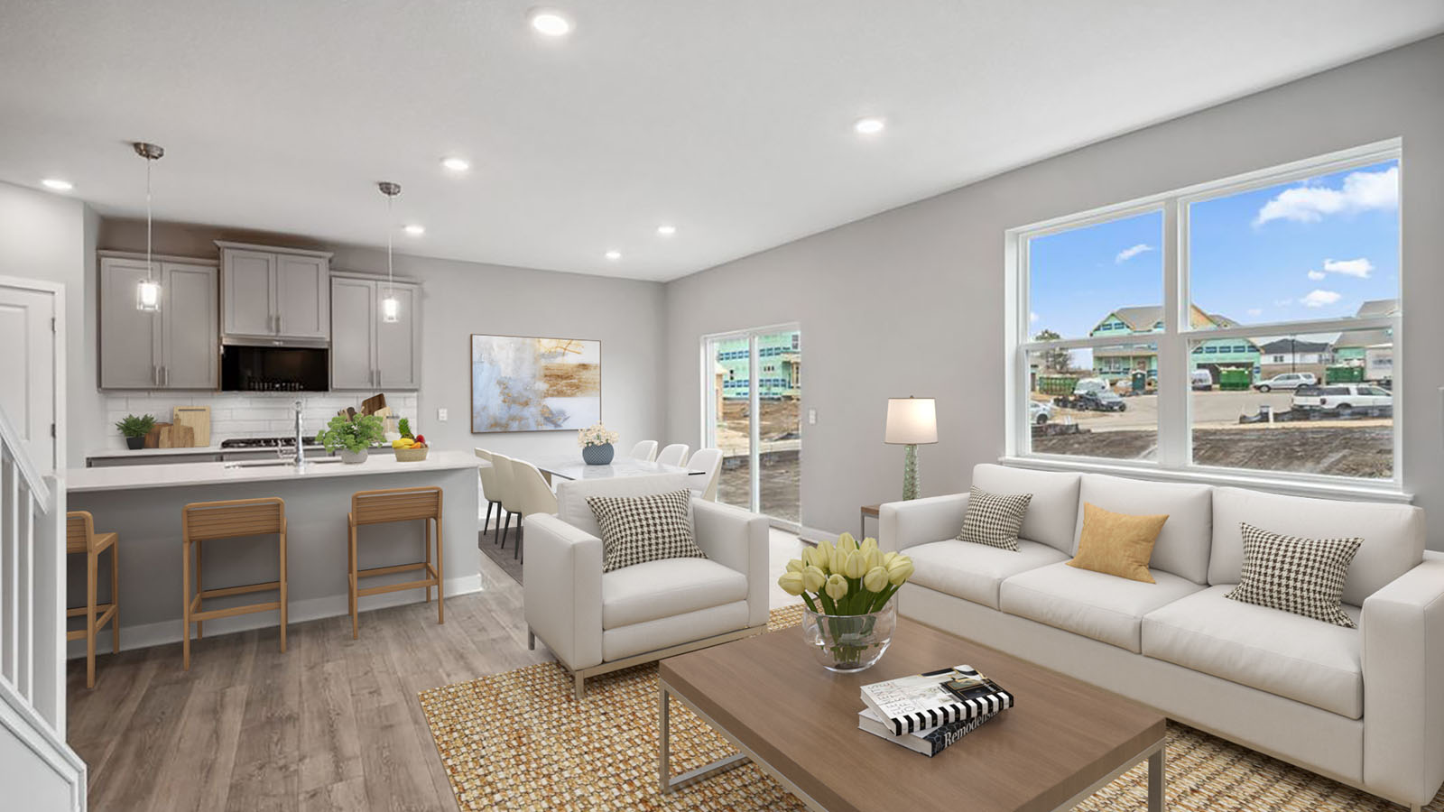 Open concept main level with family room, kitchen and dinette.