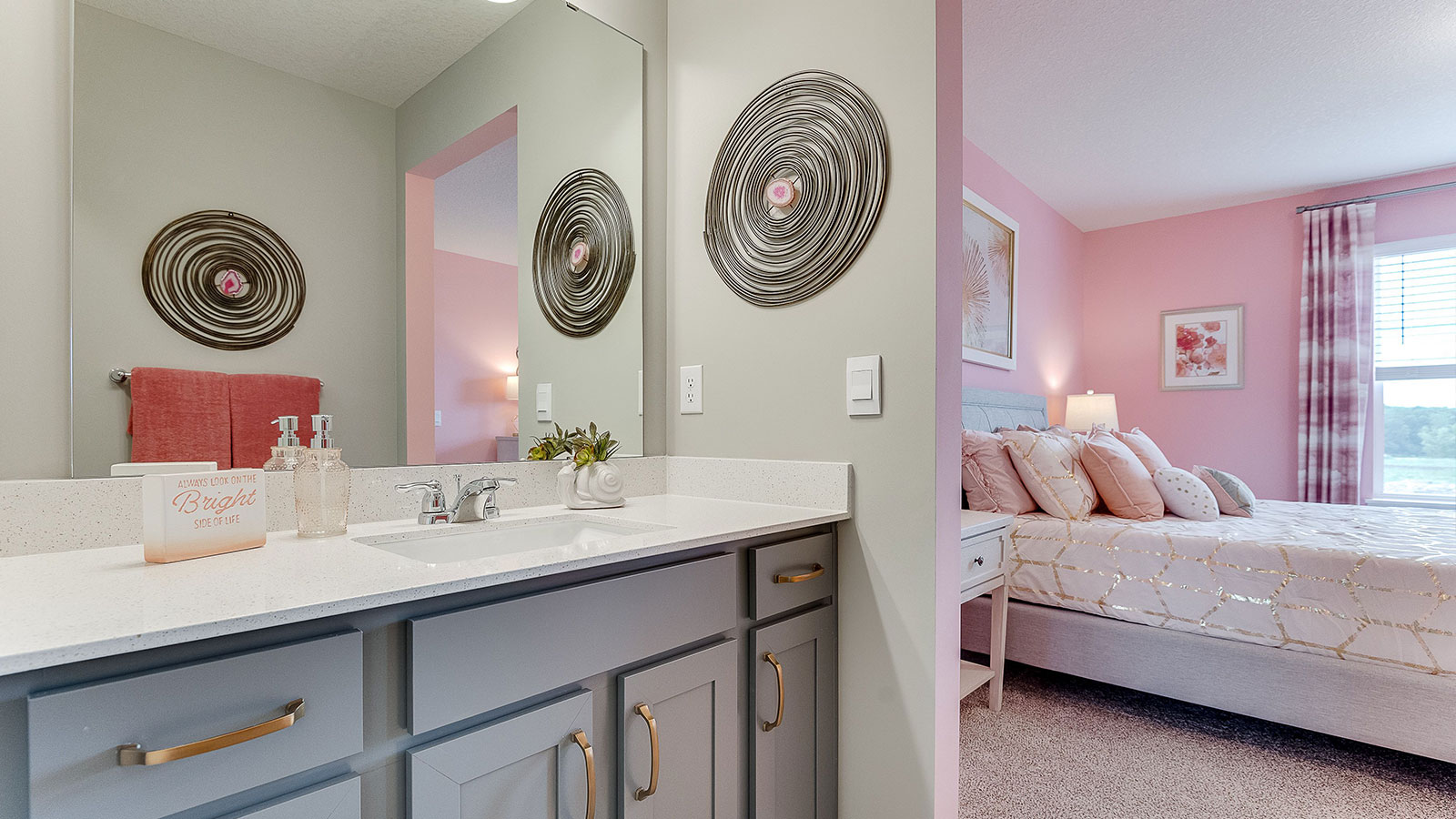 Jack and Jill bathroom with harbor gray cabinets and quartz countertops.