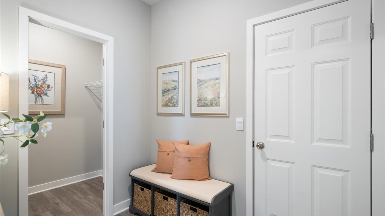 Spacious mud room with walkin closet.