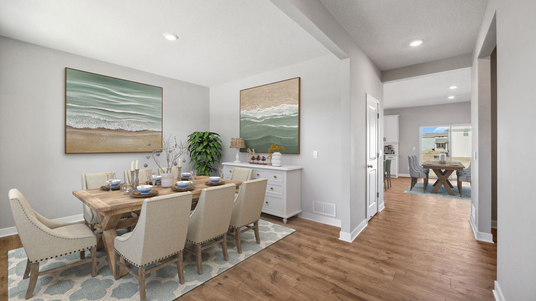formal dining room next to the entrance of the home
